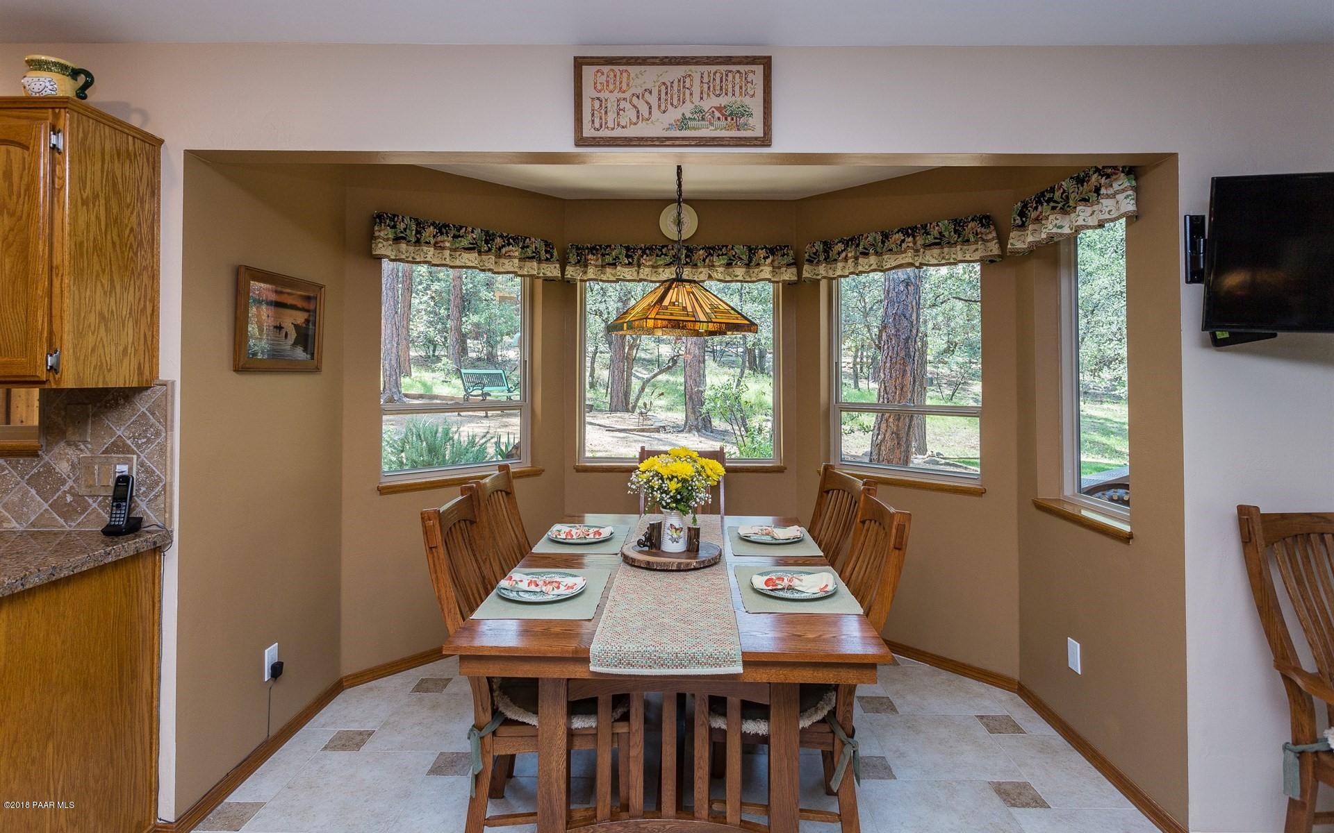 1631 Kaibab Loop Prescott, AZ 86303 - Photo 9 of 45 a view of a dining room with furniture window and outside view