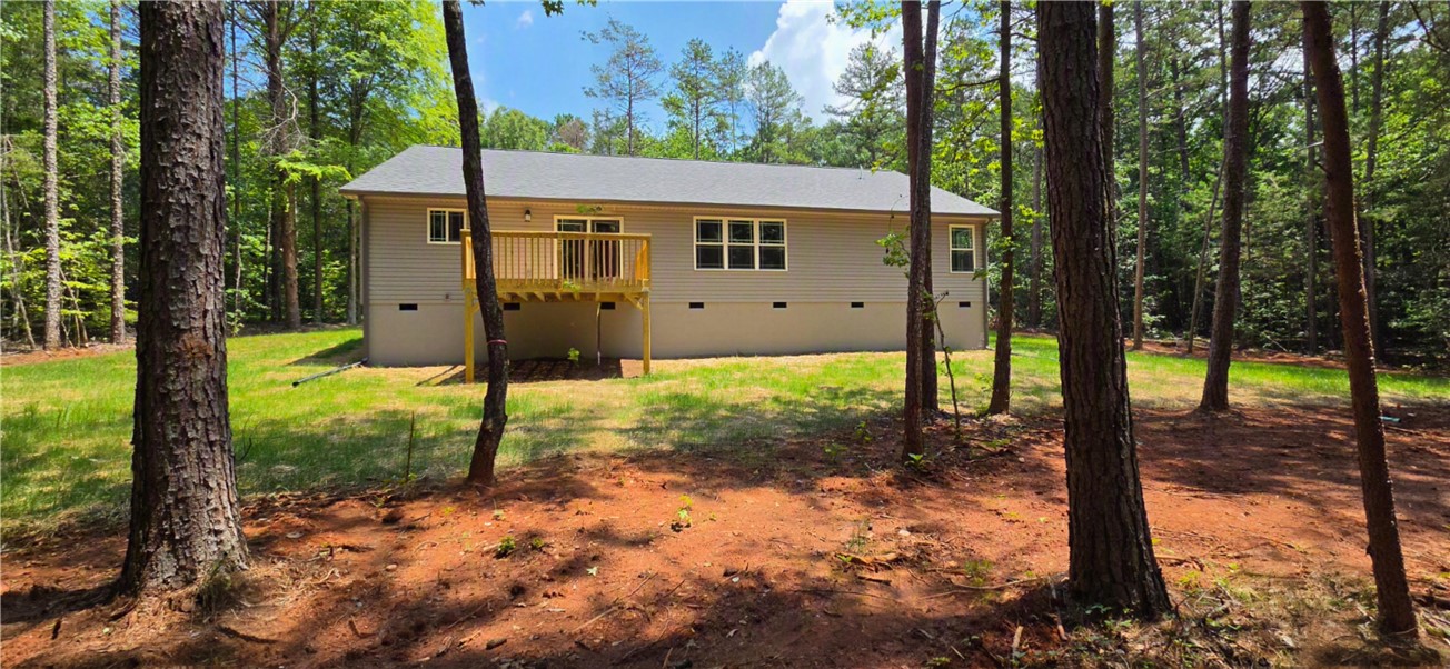 1747 A State Rd S-4-97 Anderson, SC 29621 - Photo 40 of 47 A private oasis tucked away amongst verdant trees, featuring a cozy rear deck.
