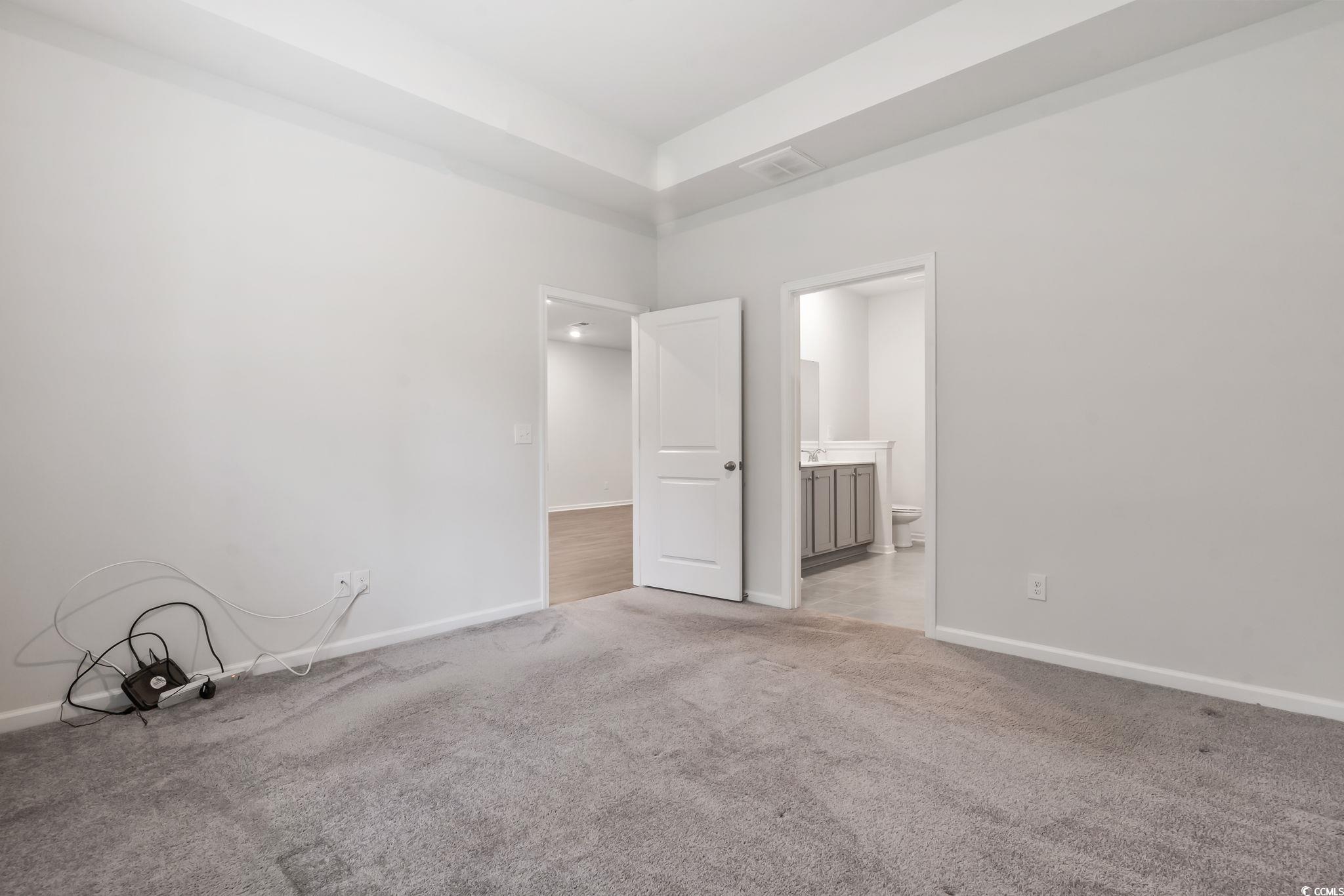 62 Sea Shell Drive, Unit 62 Murrells Inlet, SC 29576 - Photo 18 of 34 Empty room with light carpet and baseboards