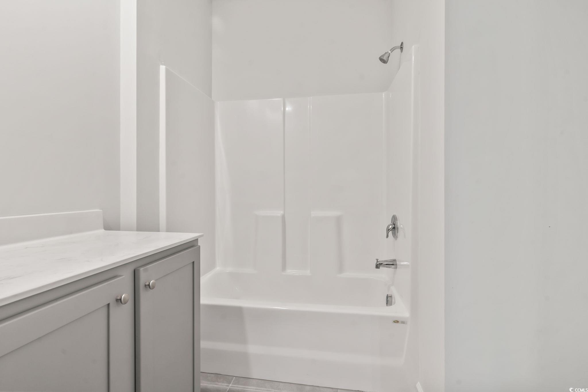 62 Sea Shell Drive, Unit 62 Murrells Inlet, SC 29576 - Photo 22 of 34 Bathroom with shower / washtub combination and vanity