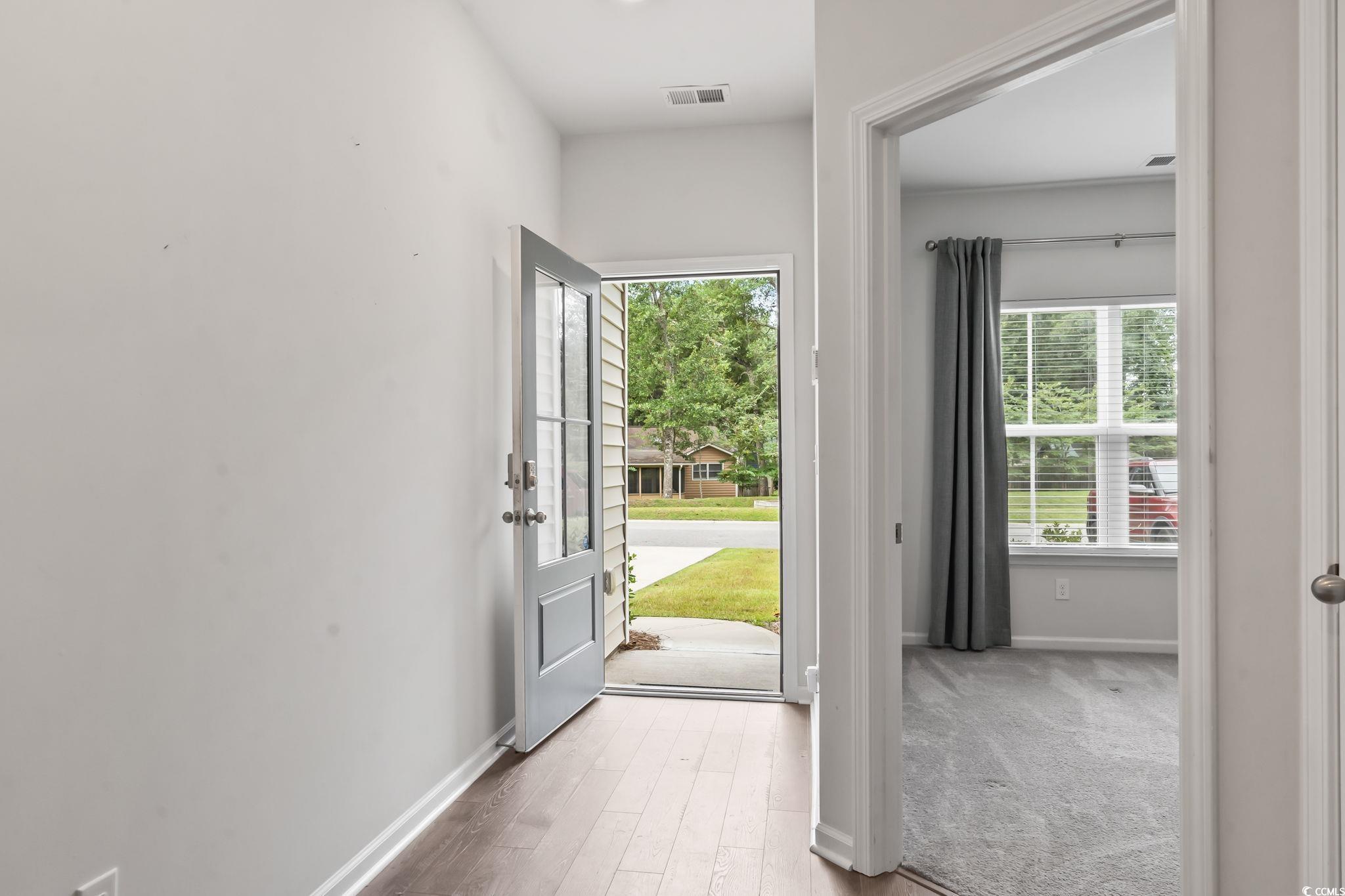62 Sea Shell Drive, Unit 62 Murrells Inlet, SC 29576 - Photo 26 of 34 Foyer featuring healthy amount of natural light and wood finished floors