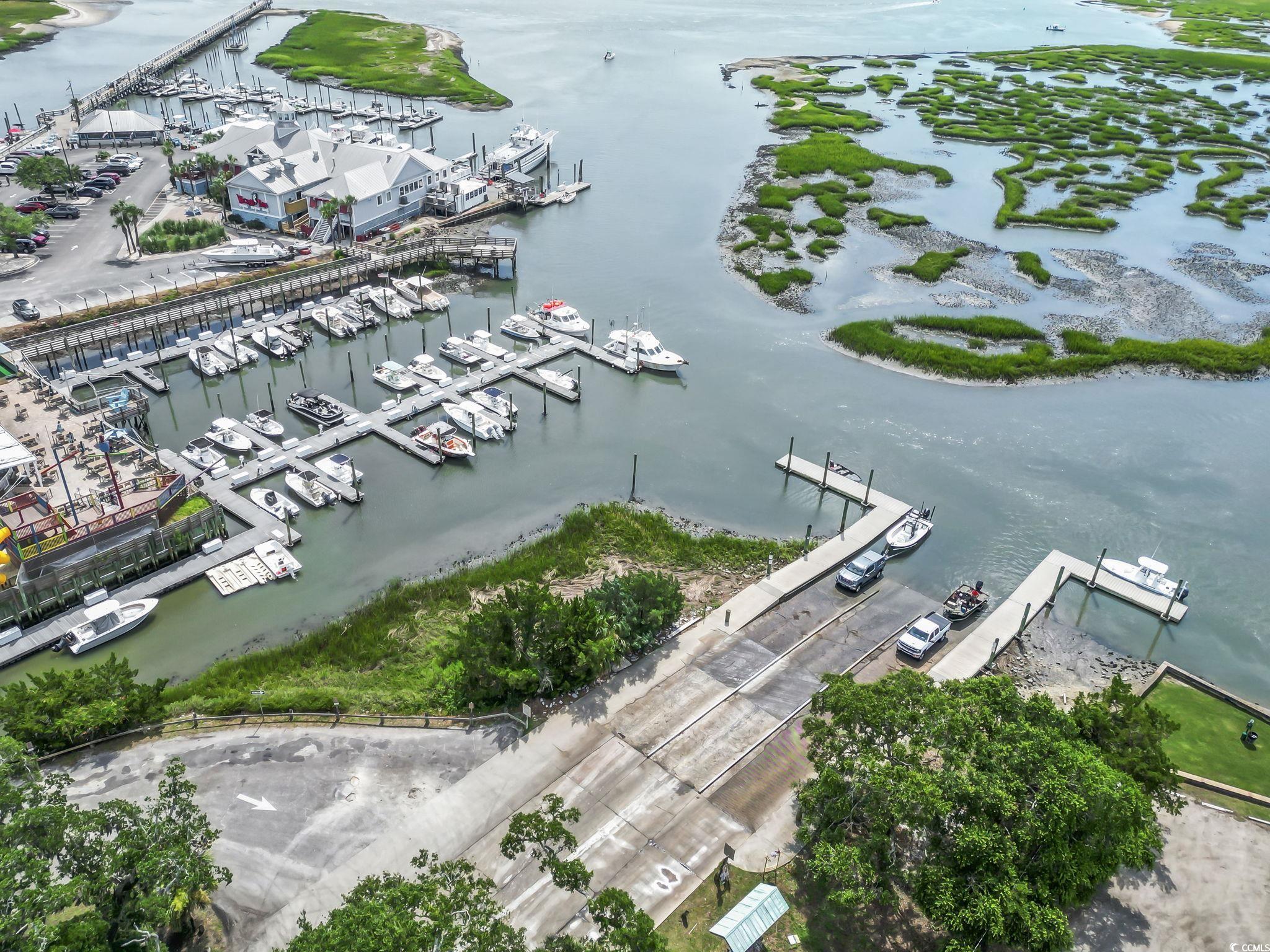 62 Sea Shell Drive, Unit 62 Murrells Inlet, SC 29576 - Photo 30 of 34 Bird's eye view of numerous boat docks and a large body of water