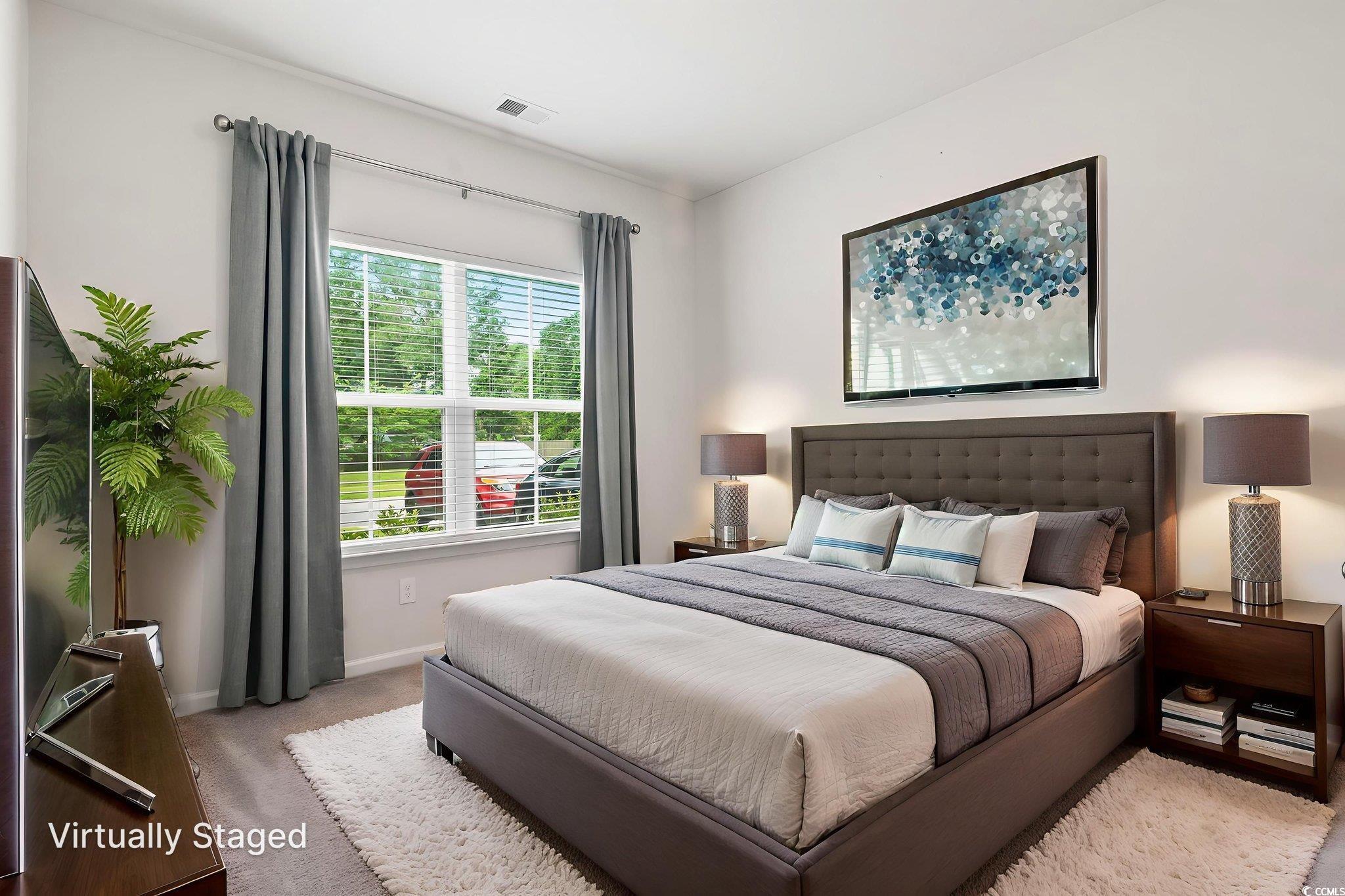 62 Sea Shell Drive, Unit 62 Murrells Inlet, SC 29576 - Photo 6 of 34 Bedroom with light carpet and baseboards