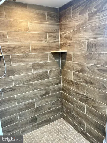 a bathroom with a sink mirror and vanity