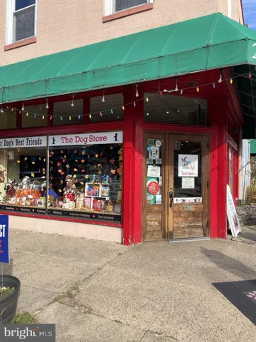 a view of a store with parking space