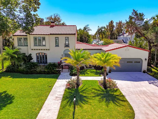 a house with garden in front of it