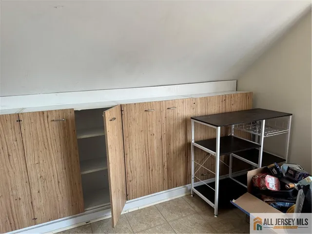 a room with walk in closet and window