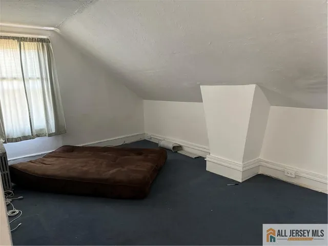 a room with a bed and a window