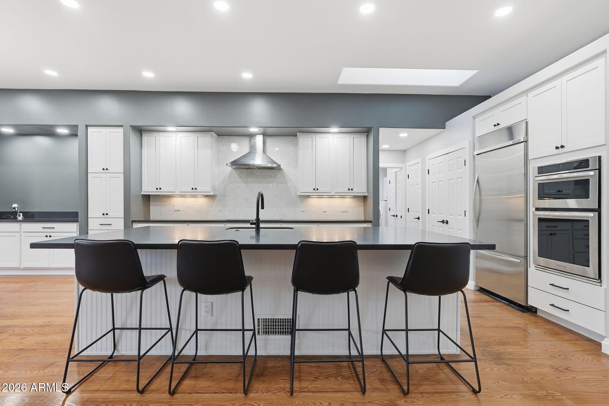 3441 Griffiths Spring Flagstaff, AZ 86005 - Photo 21 of 71 a kitchen with stainless steel appliances kitchen island granite countertop a stove a sink and a refrigerator