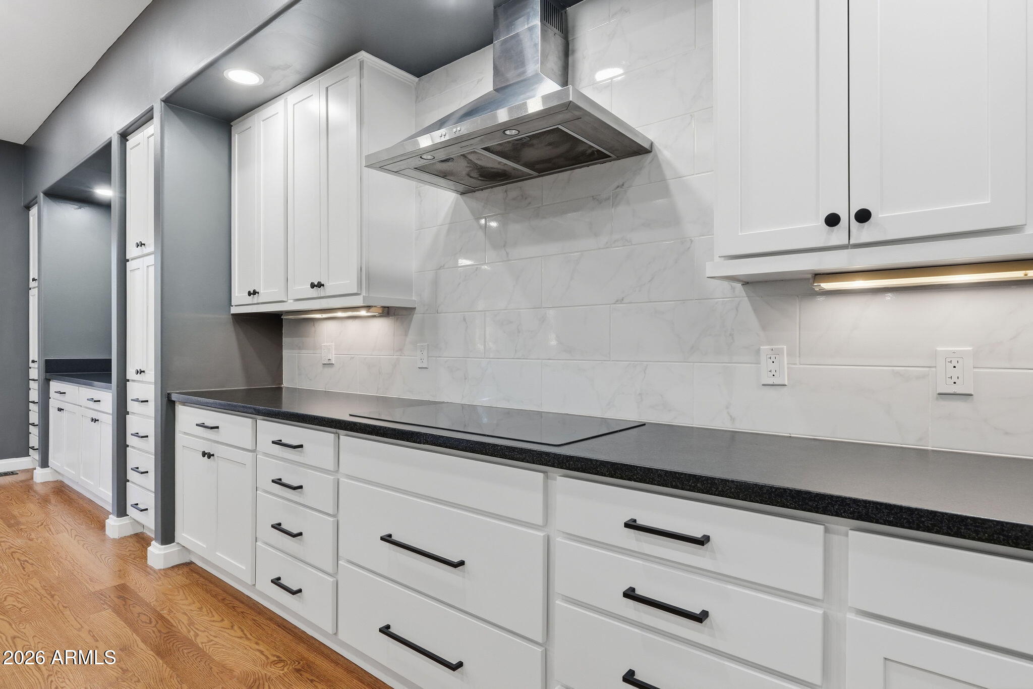 3441 Griffiths Spring Flagstaff, AZ 86005 - Photo 24 of 71 a kitchen with white cabinets and a stove