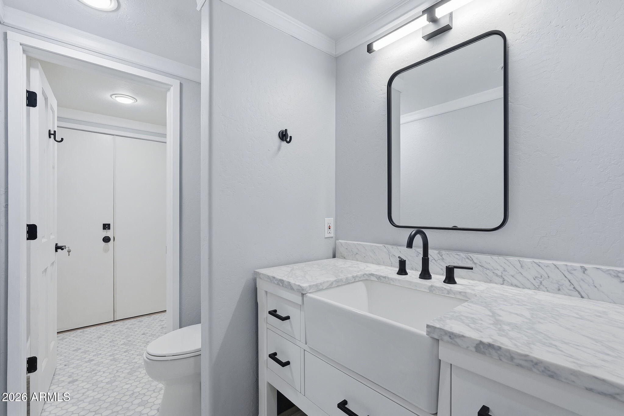 3441 Griffiths Spring Flagstaff, AZ 86005 - Photo 49 of 71 a bathroom with a toilet sink and mirror