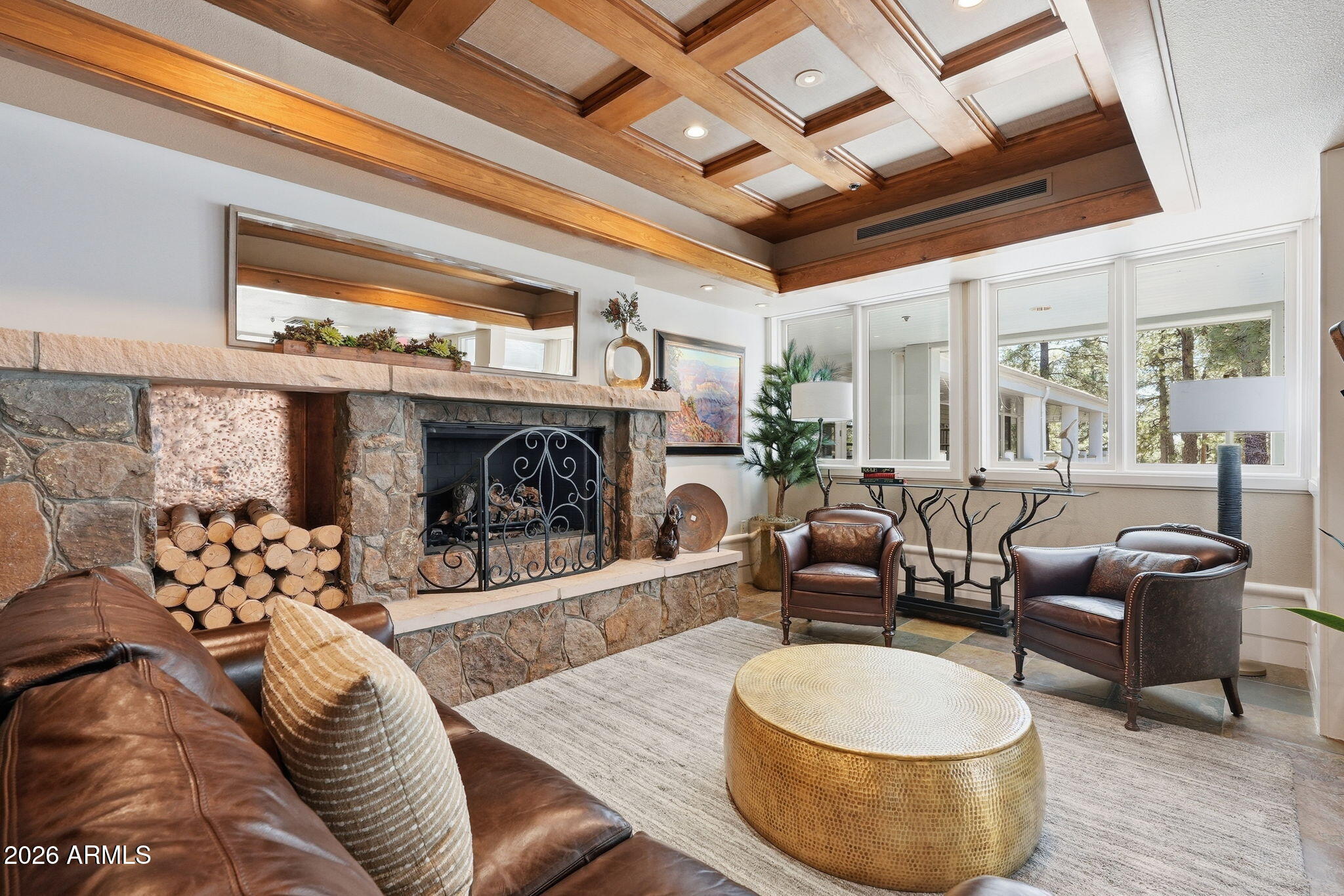 3441 Griffiths Spring Flagstaff, AZ 86005 - Photo 57 of 71 a living room with furniture and a fireplace