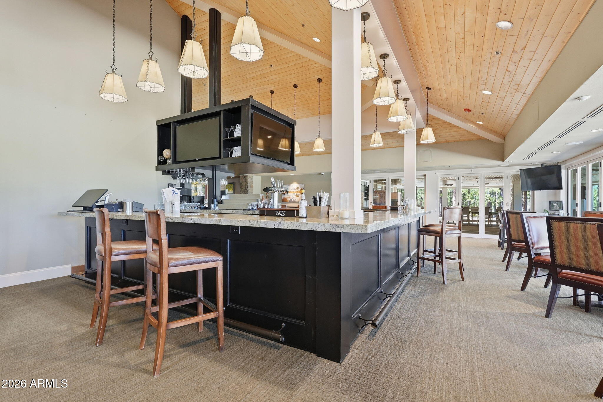3441 Griffiths Spring Flagstaff, AZ 86005 - Photo 58 of 71 a room with stainless steel appliances kitchen island granite countertop a table chairs in it and a view of kitchen
