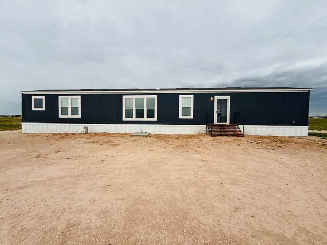 a front view of house with yard