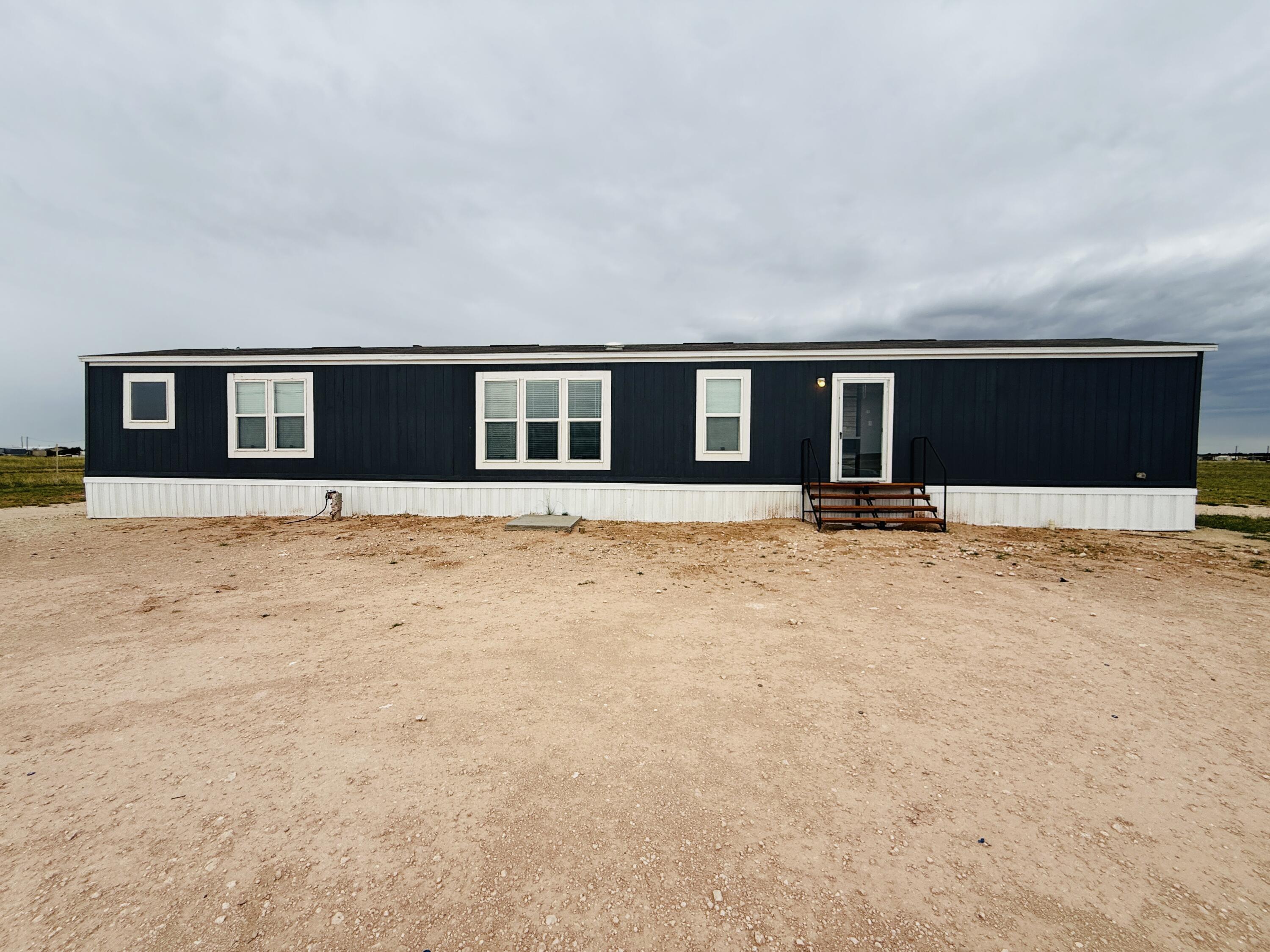 a front view of house with yard