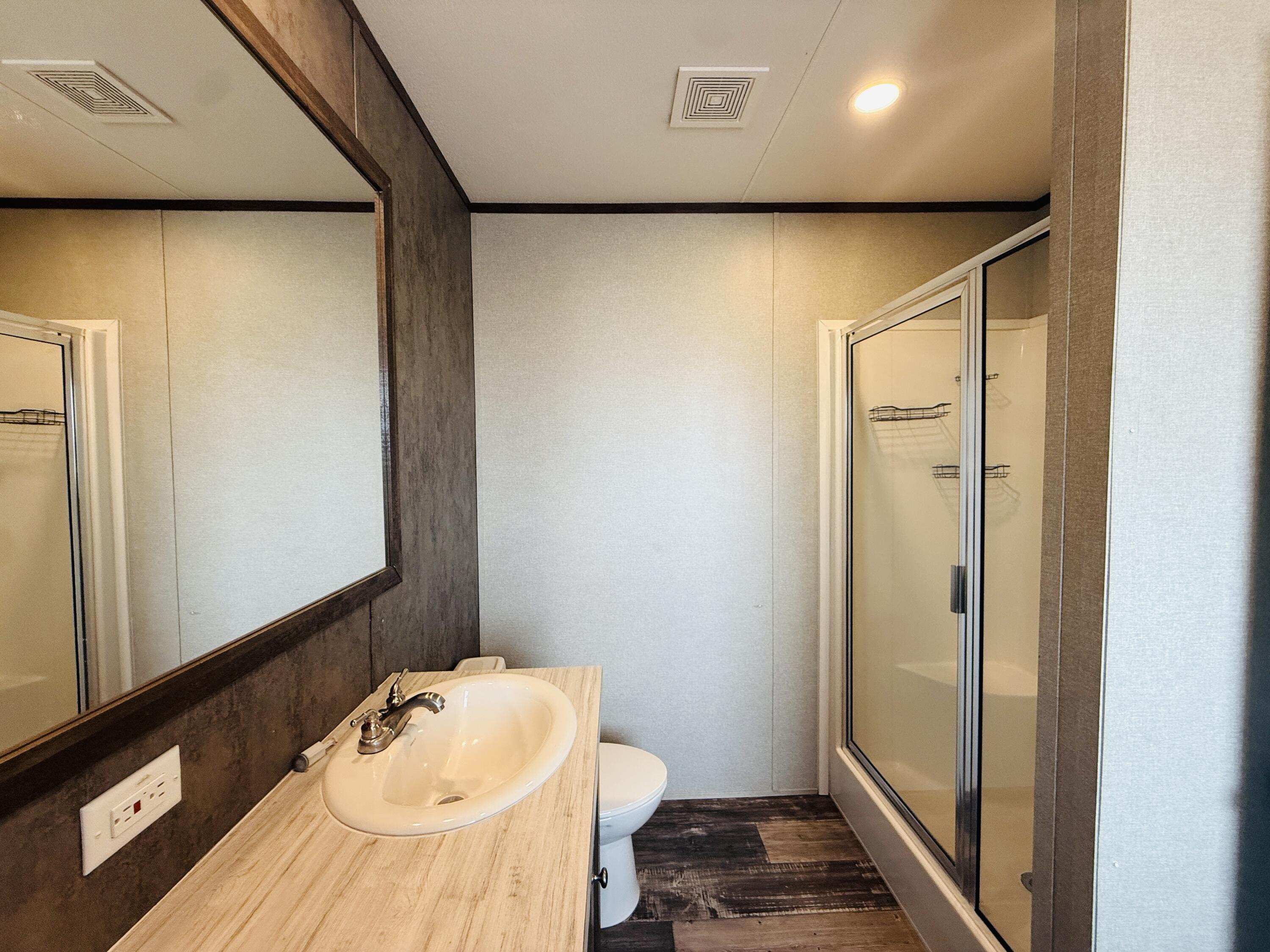 365 Private Road 211 Road North Seminole, TX 79360 - Photo 16 of 22 a bathroom with a tub and sink