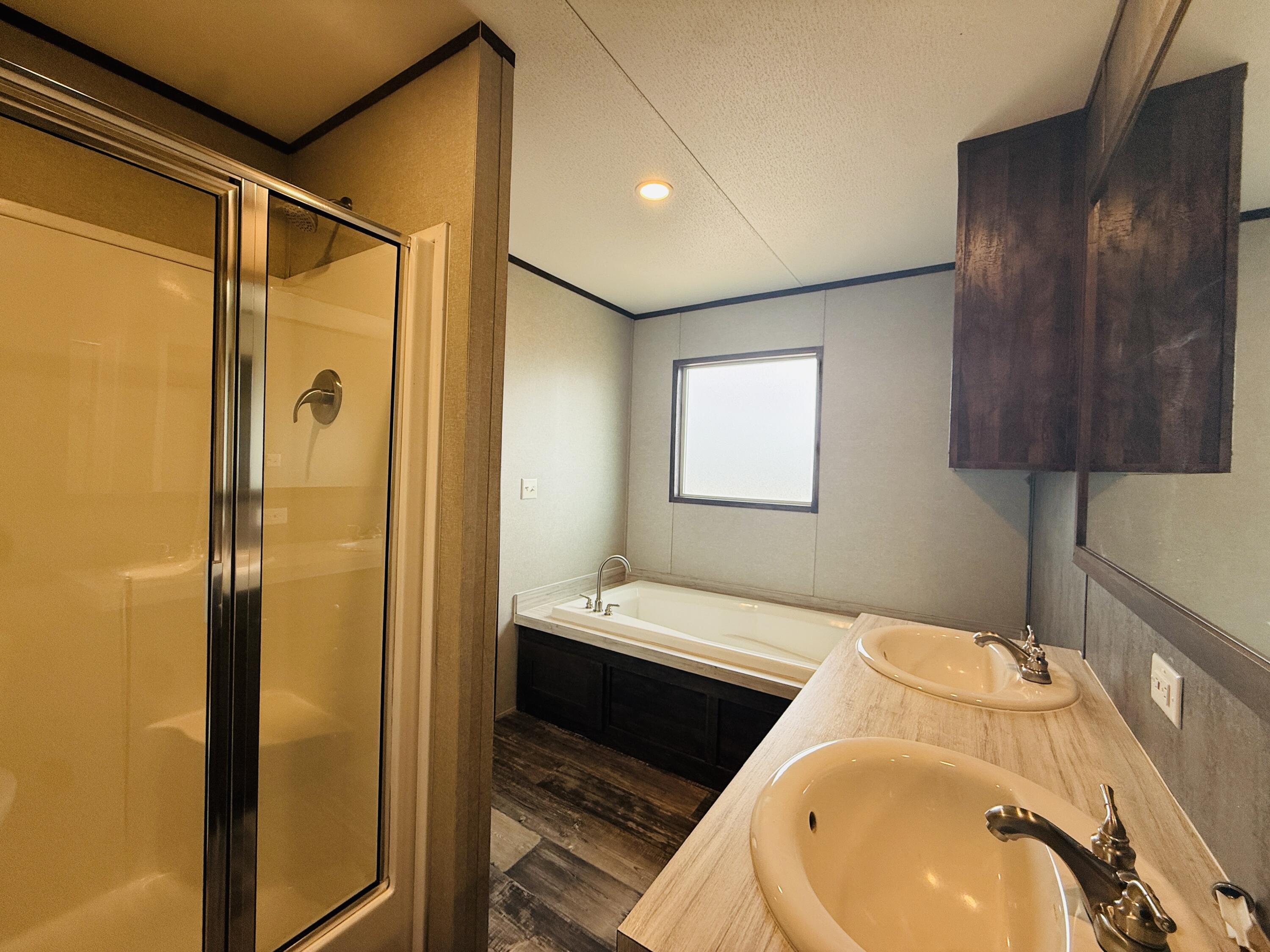 365 Private Road 211 Road North Seminole, TX 79360 - Photo 17 of 22 a bathroom with a sink and a mirror