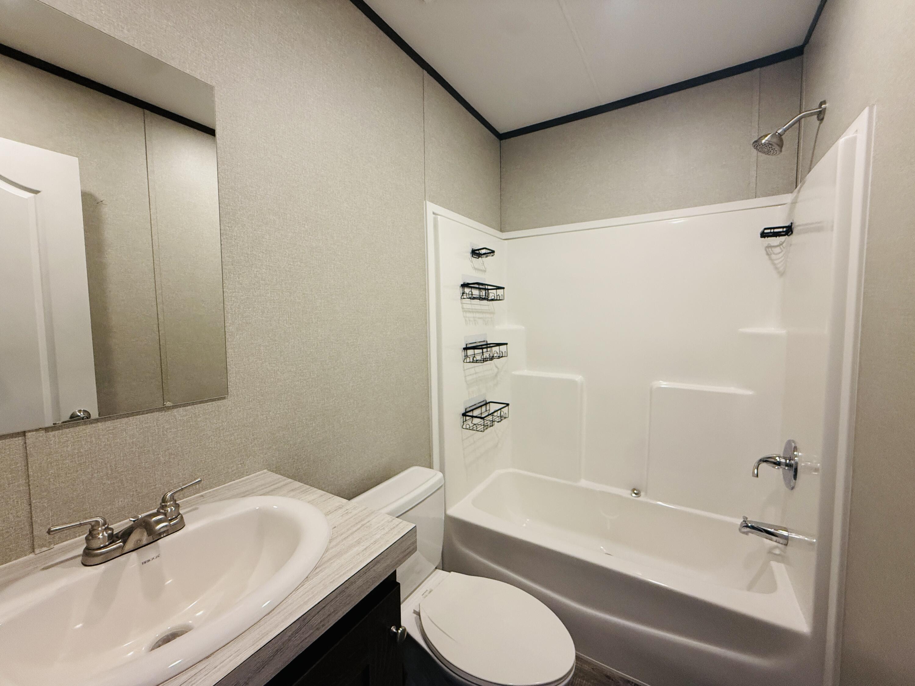 365 Private Road 211 Road North Seminole, TX 79360 - Photo 21 of 22 a bathroom with a sink toilet and shower