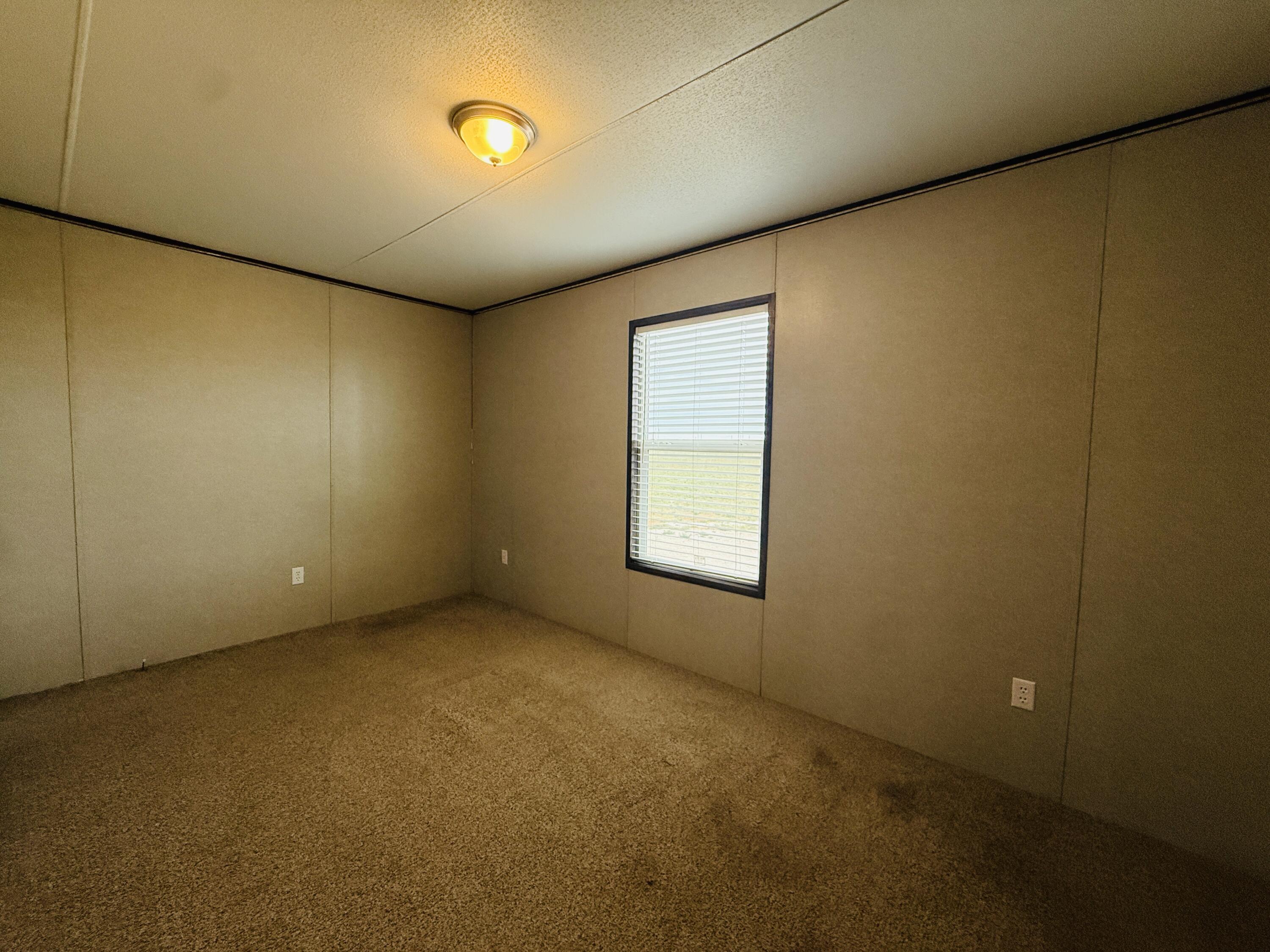 365 Private Road 211 Road North Seminole, TX 79360 - Photo 22 of 22 an empty room with windows
