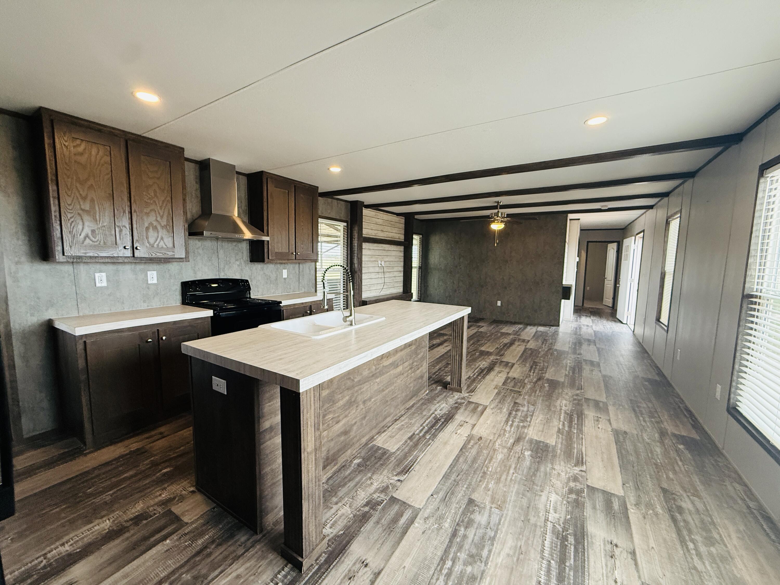 365 Private Road 211 Road North Seminole, TX 79360 - Photo 10 of 22 a kitchen with a sink stove and cabinets