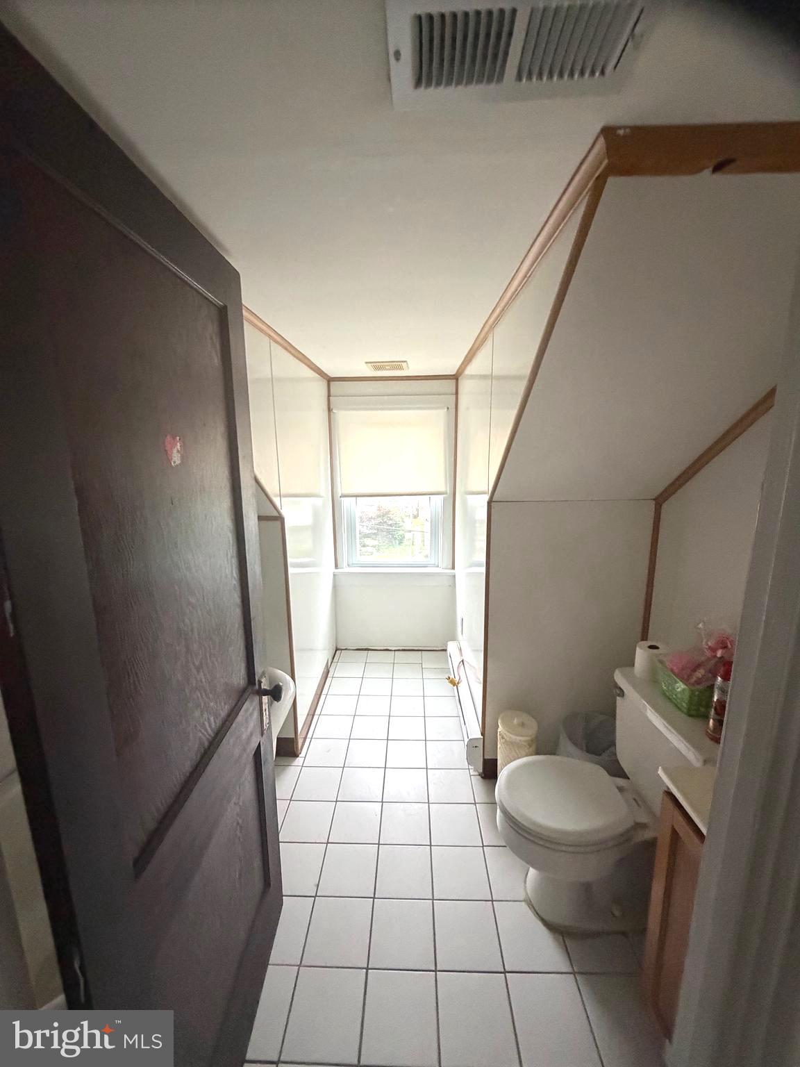 463 Burmont Road Drexel Hill, PA 19026 - Photo 29 of 39 a bathroom with a sink a toilet a window and shower