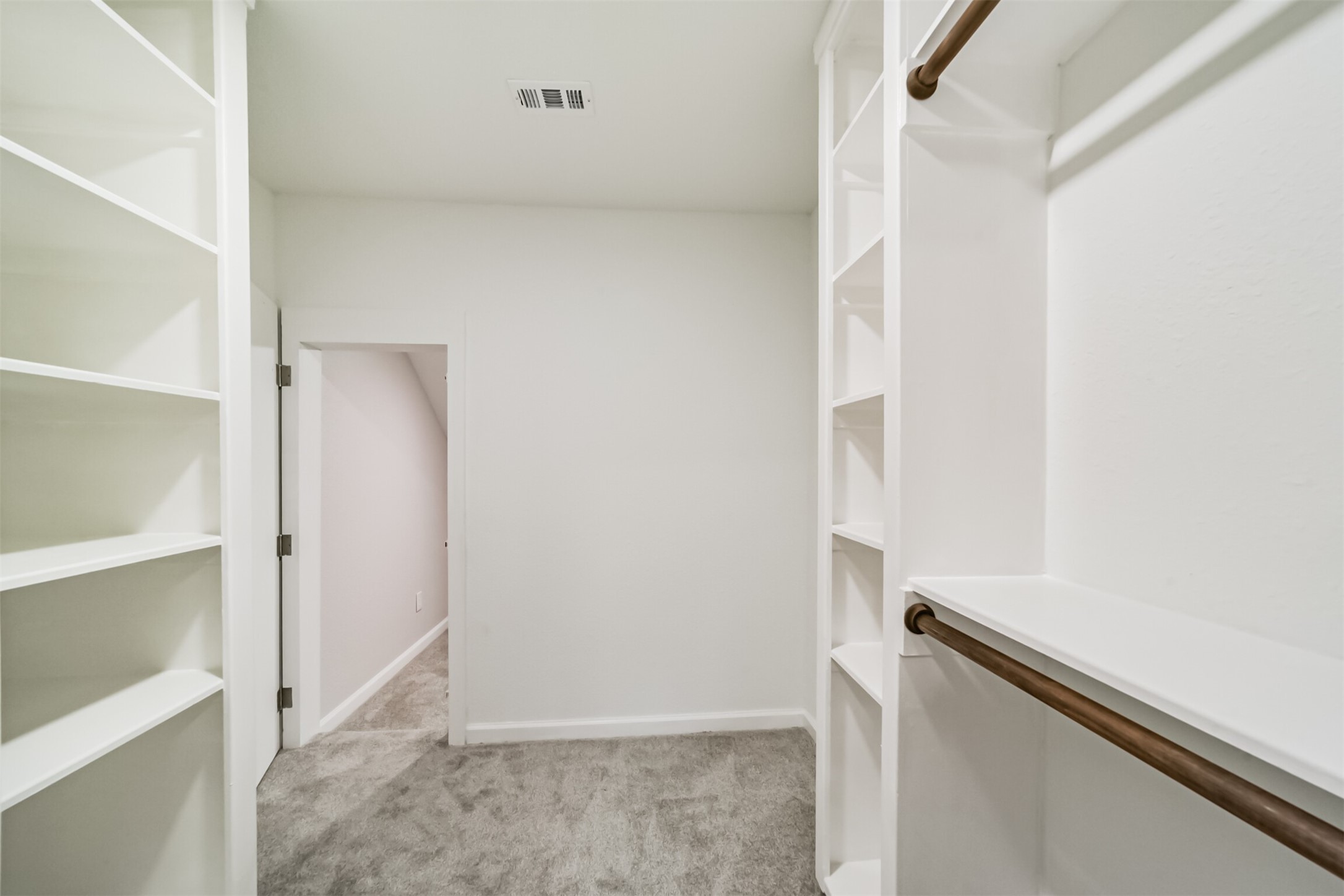 15610 Ripplewind Lane Houston, TX 77068 - Photo 37 of 44 a view of an empty walk in closet