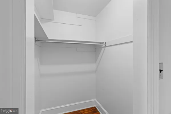 a view of an empty walk in closet