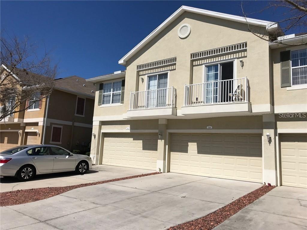 a front view of a house with parking