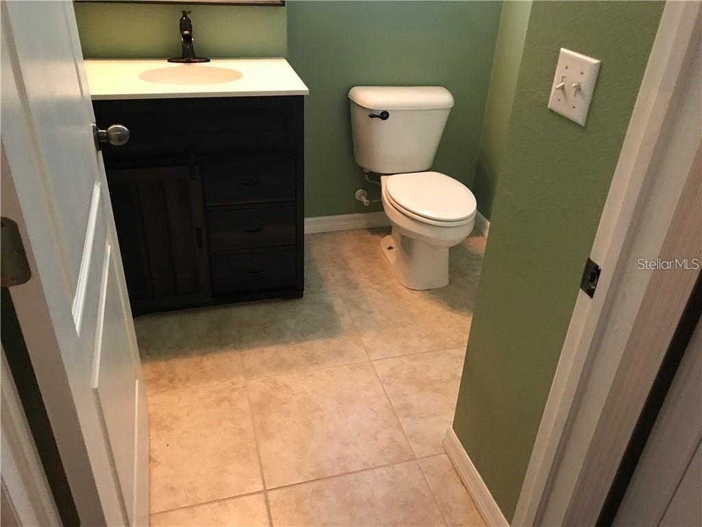 7542 Red Mill Circle New Port Richey, FL 34653 - Photo 14 of 27 a bathroom with a sink and a toilet