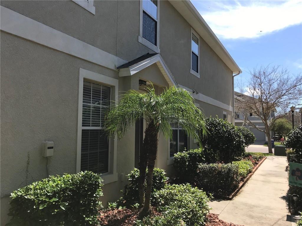 7542 Red Mill Circle New Port Richey, FL 34653 - Photo 2 of 27 a view of a house with a yard