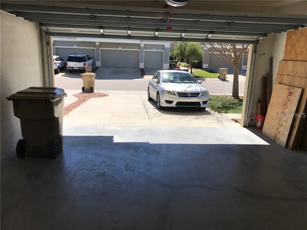 7542 Red Mill Circle New Port Richey, FL 34653 - Photo 27 of 27 a car parked in parking garage