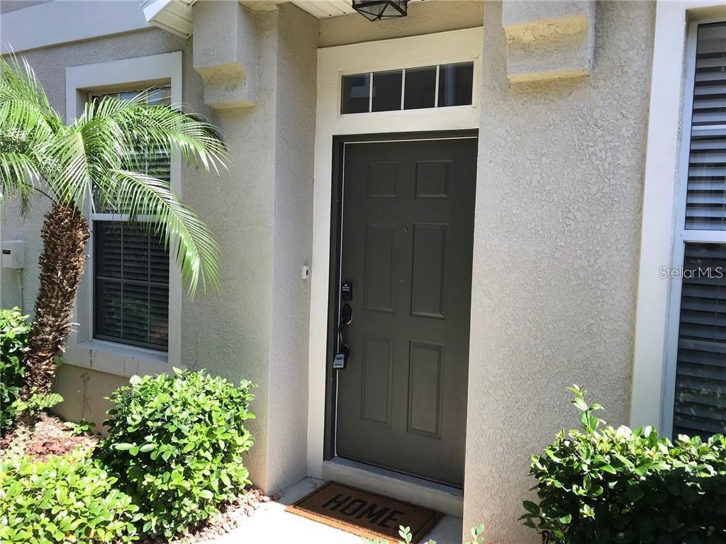 7542 Red Mill Circle New Port Richey, FL 34653 - Photo 3 of 27 a house with a outdoor space