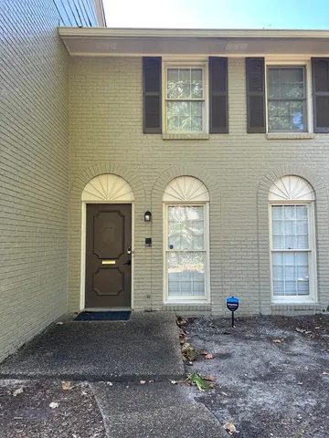 a view of empty room with windows