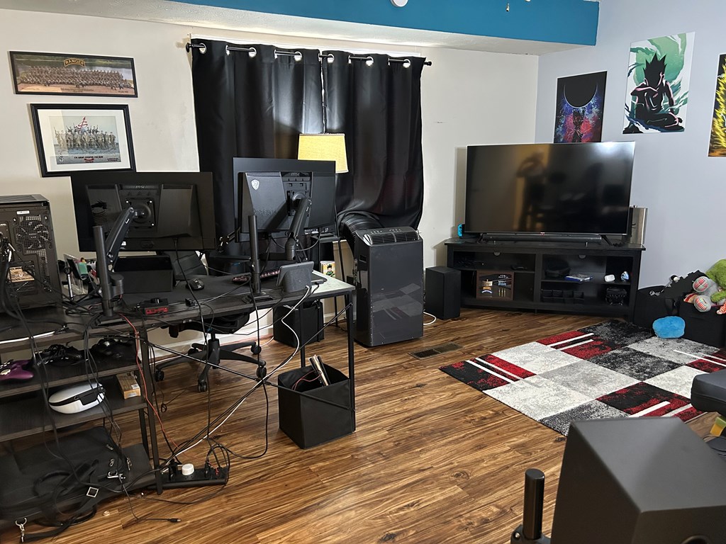 2125 13th Street, Unit 12 Columbus, GA 31906 - Photo 12 of 17 a living room with furniture and a flat screen tv