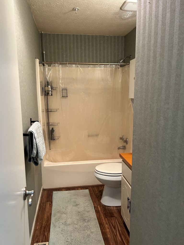 2125 13th Street, Unit 12 Columbus, GA 31906 - Photo 14 of 17 a bathroom with a toilet and a shower