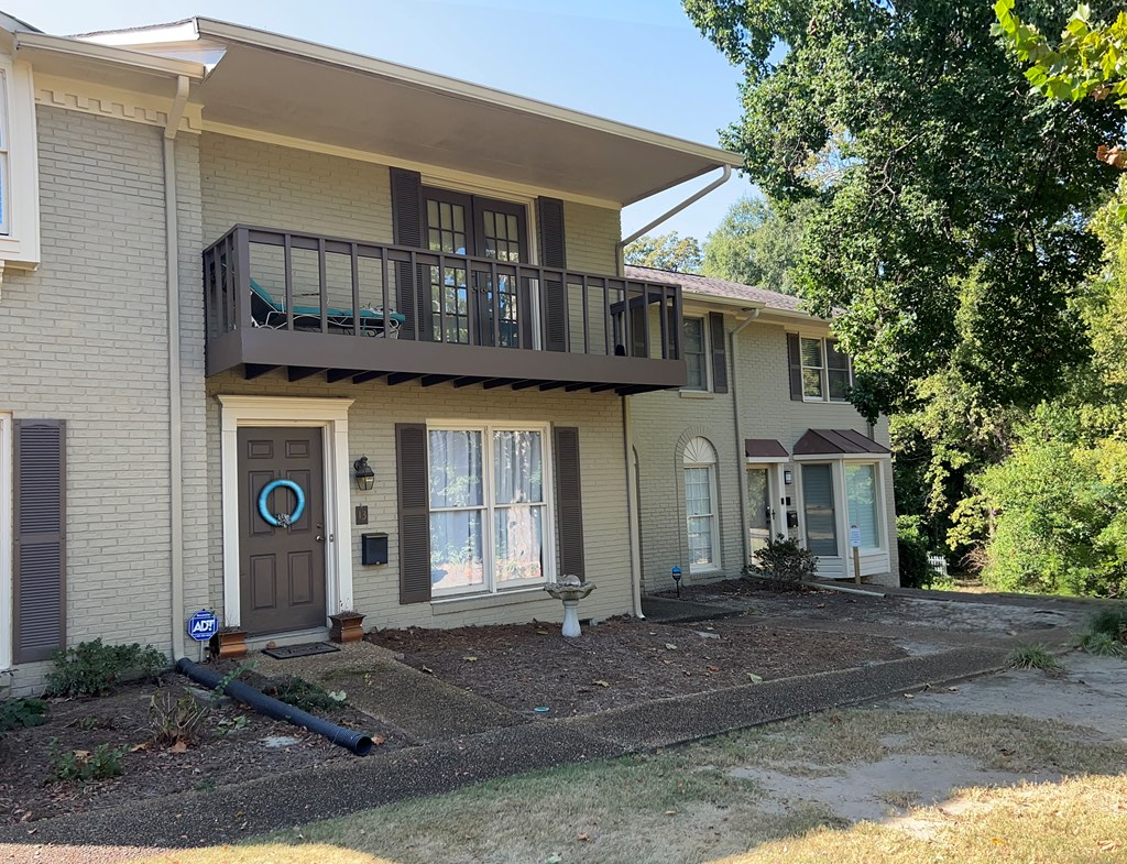 2125 13th Street, Unit 12 Columbus, GA 31906 - Photo 2 of 17 a front view of a house with garden