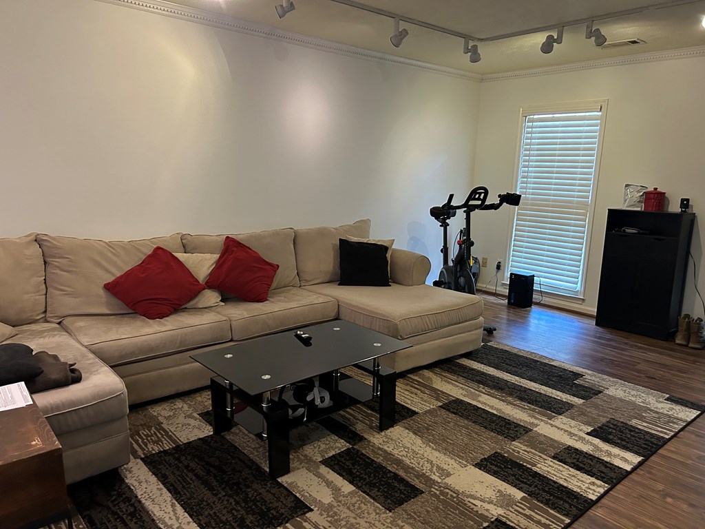 2125 13th Street, Unit 12 Columbus, GA 31906 - Photo 3 of 17 a living room with furniture rug and wooden floor