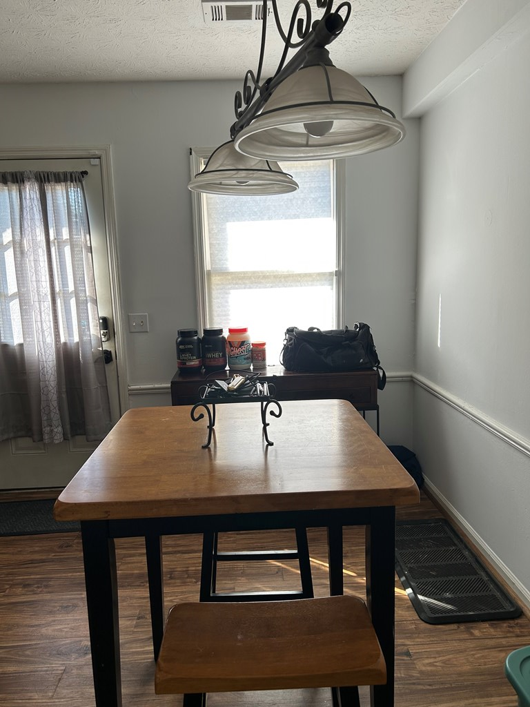 2125 13th Street, Unit 12 Columbus, GA 31906 - Photo 6 of 17 a view of a dining room with furniture and window