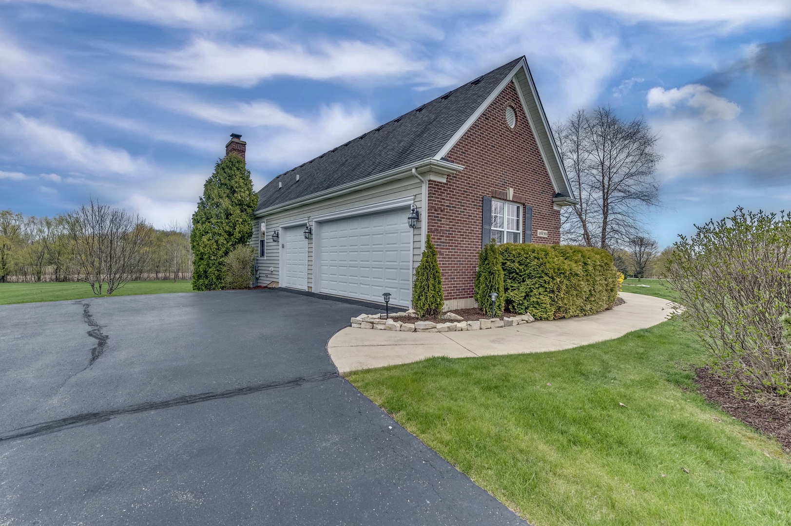 40W900 Campton Trail Road St. Charles, IL 60175 - Photo 2 of 31 a front view of a house with a yard and trees