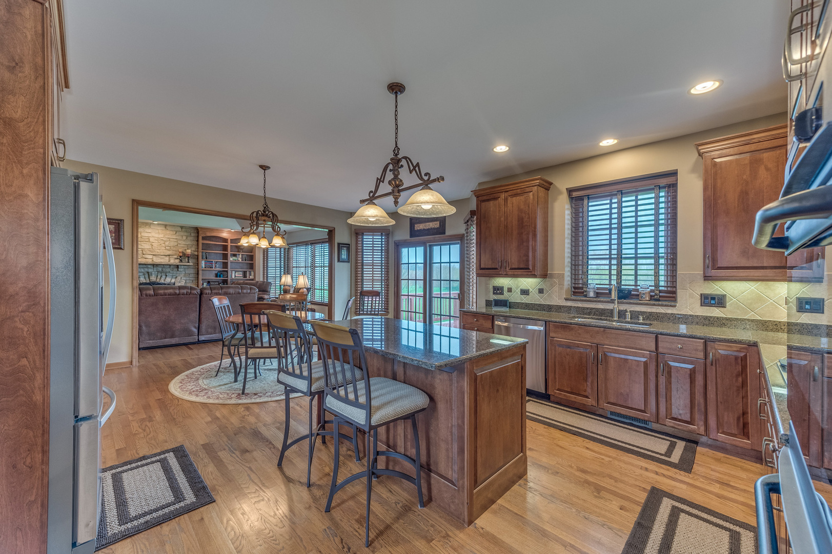 40W900 Campton Trail Road St. Charles, IL 60175 - Photo 11 of 31 a view of a dining room with furniture window and wooden floor