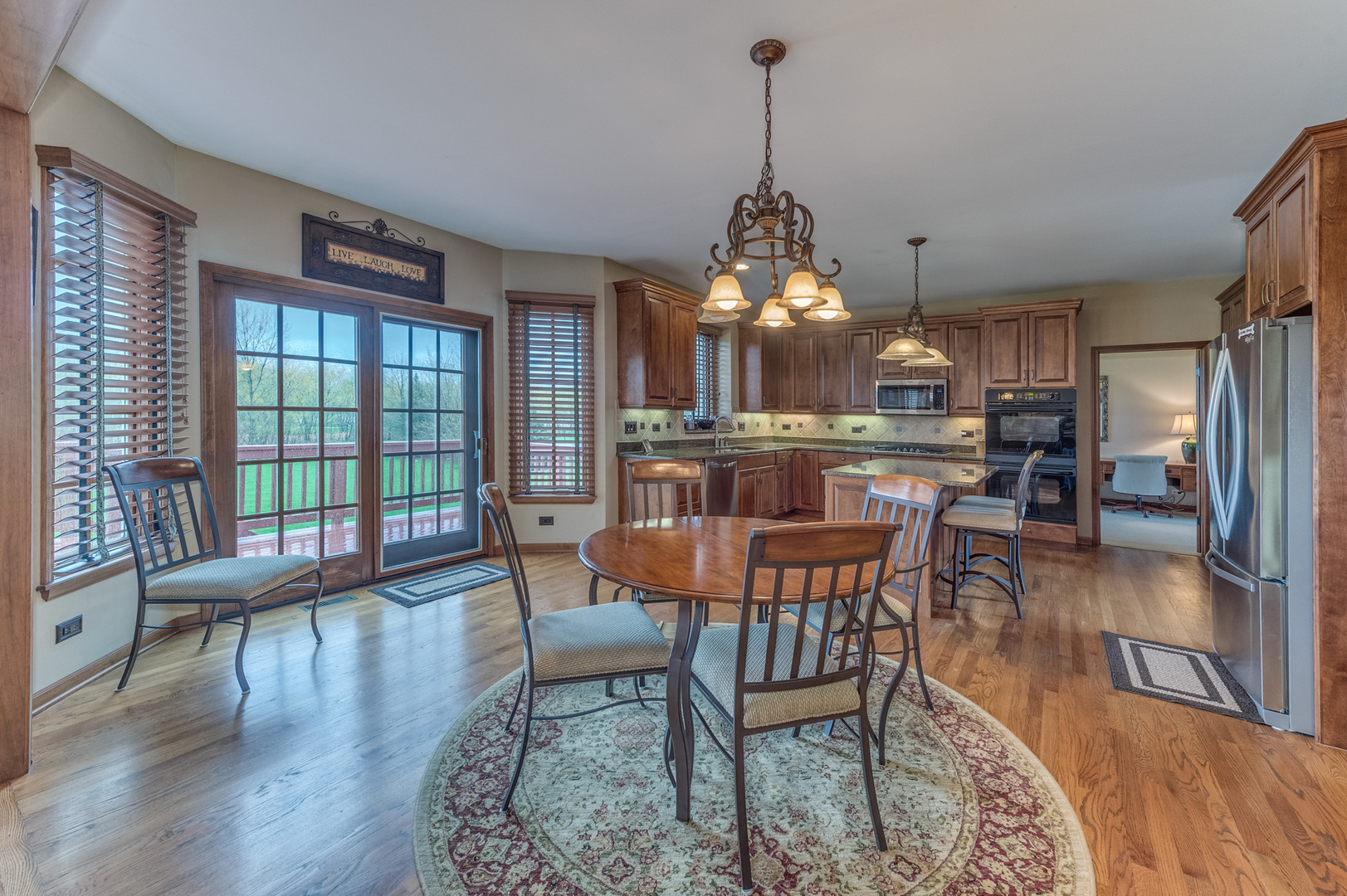 40W900 Campton Trail Road St. Charles, IL 60175 - Photo 15 of 31 a view of a dining room with furniture window and wooden floor