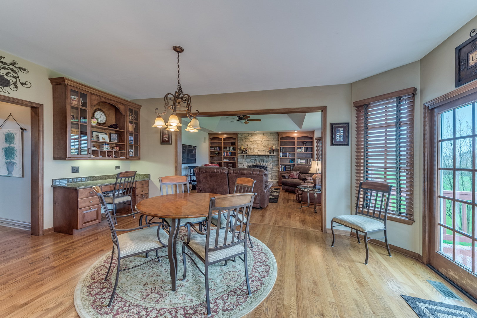 40W900 Campton Trail Road St. Charles, IL 60175 - Photo 16 of 31 a view of a dining room with furniture window and wooden floor
