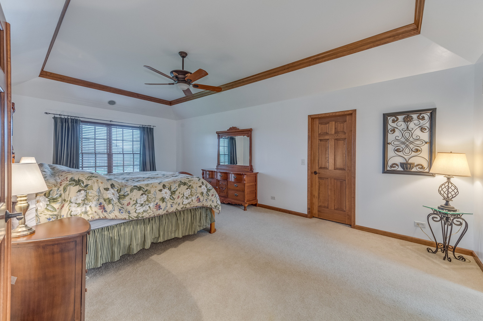 40W900 Campton Trail Road St. Charles, IL 60175 - Photo 21 of 31 a spacious bedroom with a bed a dresser and mirror