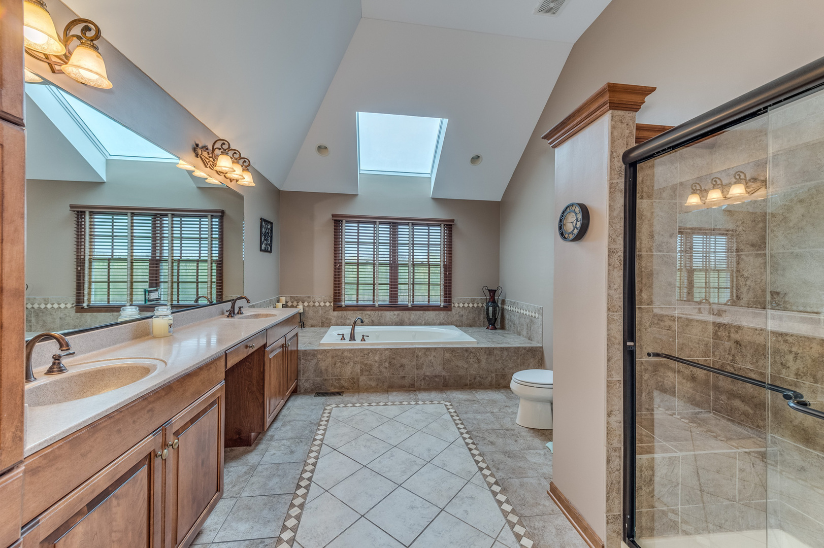 40W900 Campton Trail Road St. Charles, IL 60175 - Photo 22 of 31 a large spacious bathroom with a tub a sink and mirror