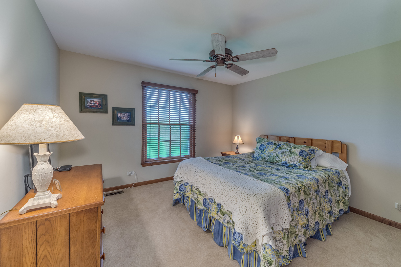 40W900 Campton Trail Road St. Charles, IL 60175 - Photo 23 of 31 a bedroom with a bed and a chandelier