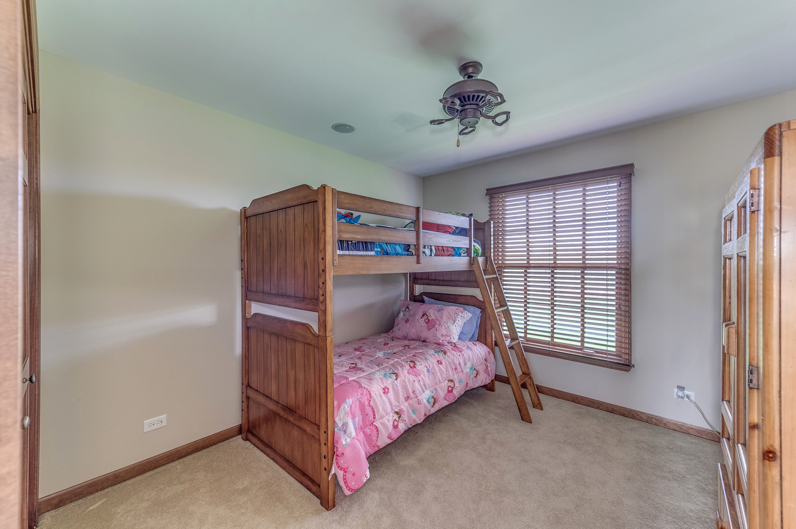 40W900 Campton Trail Road St. Charles, IL 60175 - Photo 26 of 31 a bedroom with a bed and a chandelier