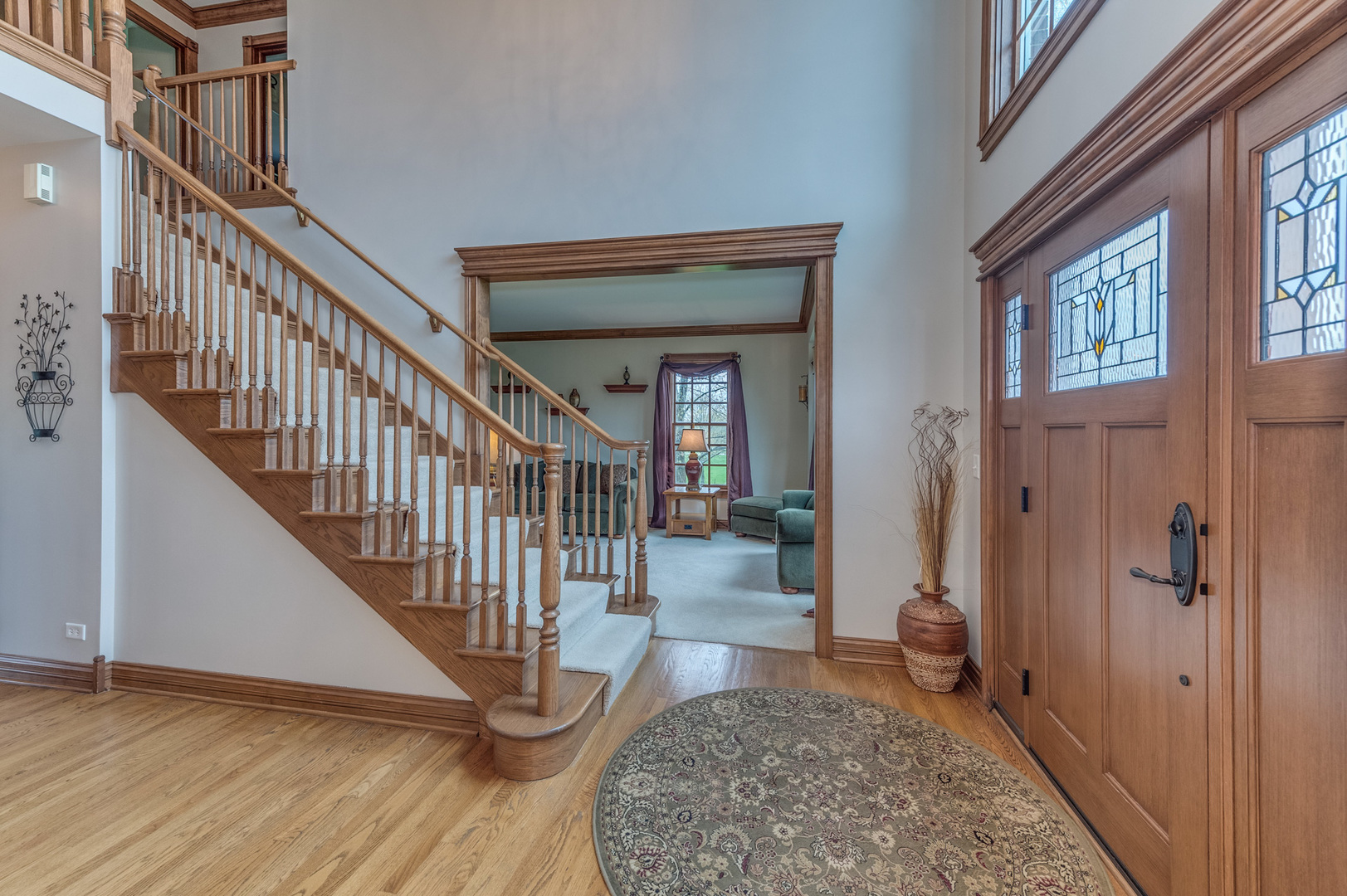 40W900 Campton Trail Road St. Charles, IL 60175 - Photo 5 of 31 a view of an entryway with wooden floor and a livingroom