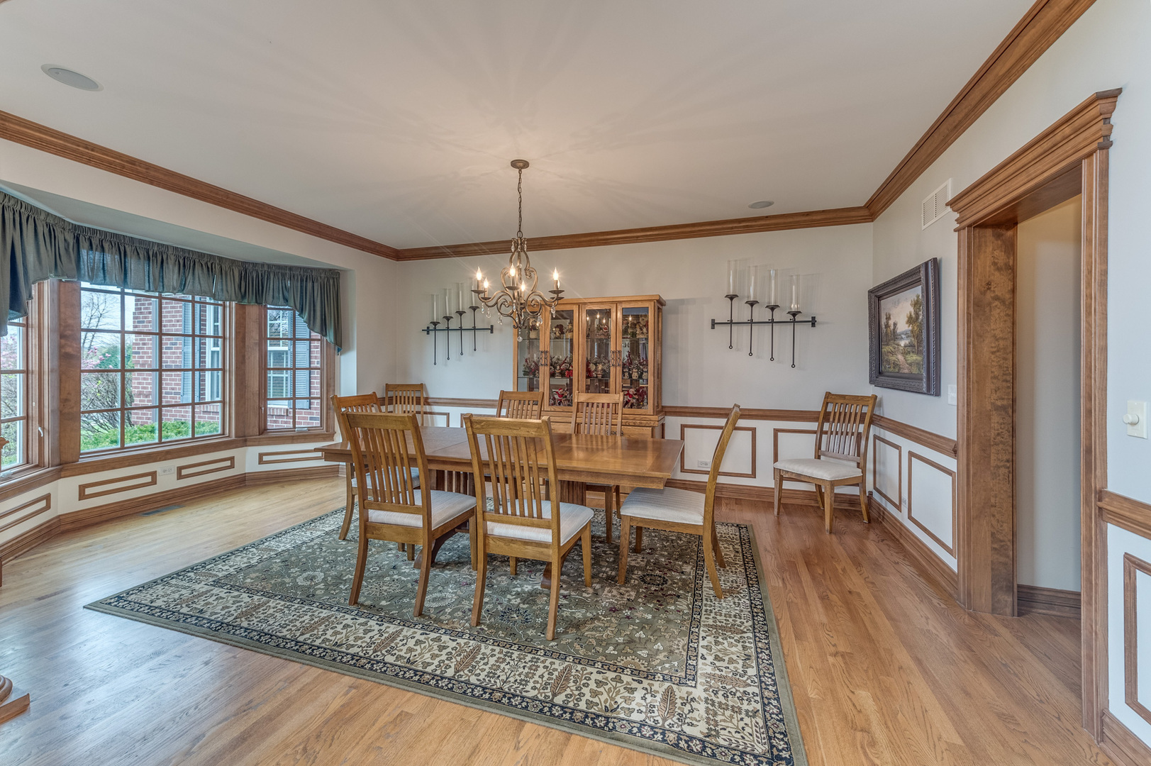 40W900 Campton Trail Road St. Charles, IL 60175 - Photo 9 of 31 a dining room with furniture a chandelier and wooden floor