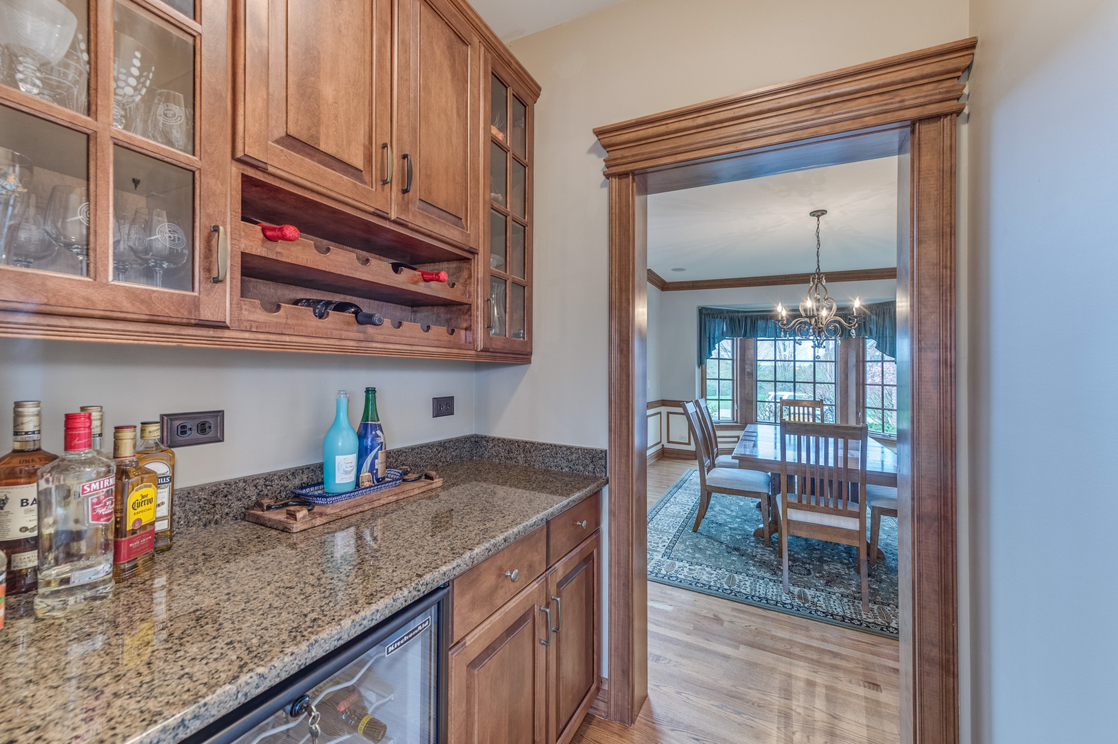 40W900 Campton Trail Road St. Charles, IL 60175 - Photo 10 of 31 a kitchen with stainless steel appliances granite countertop a sink dishwasher and cabinets with wooden floor