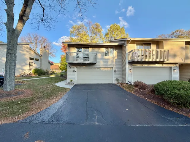 a view of a street with brick walls